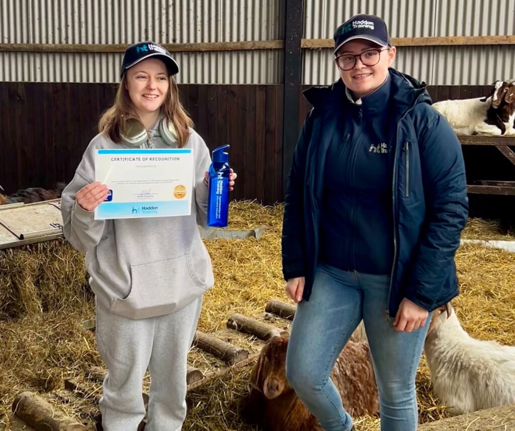 Kacey (Left) holding her certificate and Haddon Training ED&I Ambassador, Frankie Roberts (right).